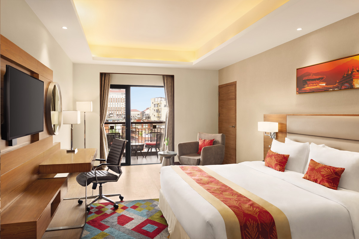 Image of Ramada Hotel deluxe room with Balcony